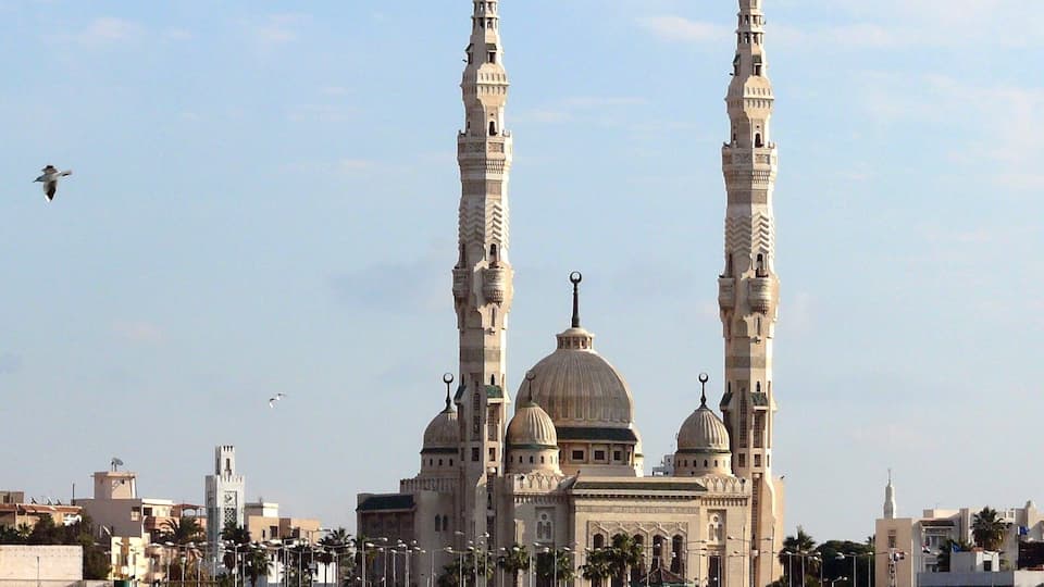 In "#PortSaid" #Egypt. Along the #Suez canal. Some beautiful architecture. And you got to love these long thin minarets.
