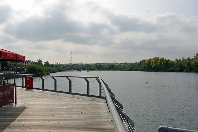 View from The Boardwalk. This is the view from 1497842 across the remnants of the lake at "Lakeside" before the construction of the Retail Park in the early 1980's and the Shopping centre in the following decade the lake in a flooded gravel pit covered about four times its current area.