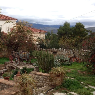 Handmade and painted carriage from the 1900's, in the garden of Archodiko Art Hotel