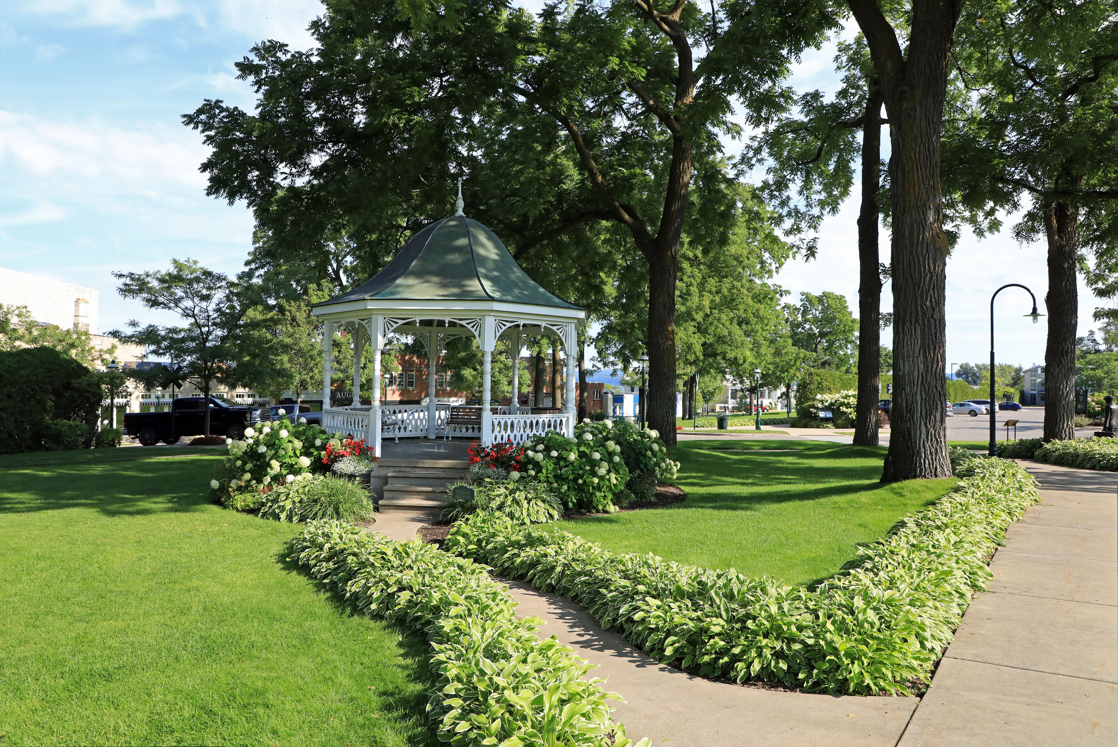 Gazebos are freestanding or attached to a garden wall, roofed, and open on all sides. They provide shade, shelter from rain and a place to rest, while acting as an ornamental feature. 