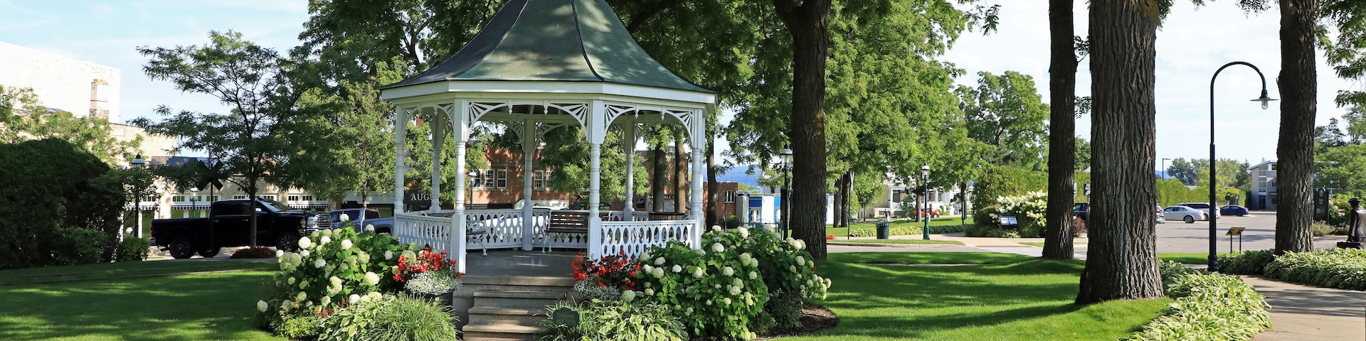 Gazebos are freestanding or attached to a garden wall, roofed, and open on all sides. They provide shade, shelter from rain and a place to rest, while acting as an ornamental feature.