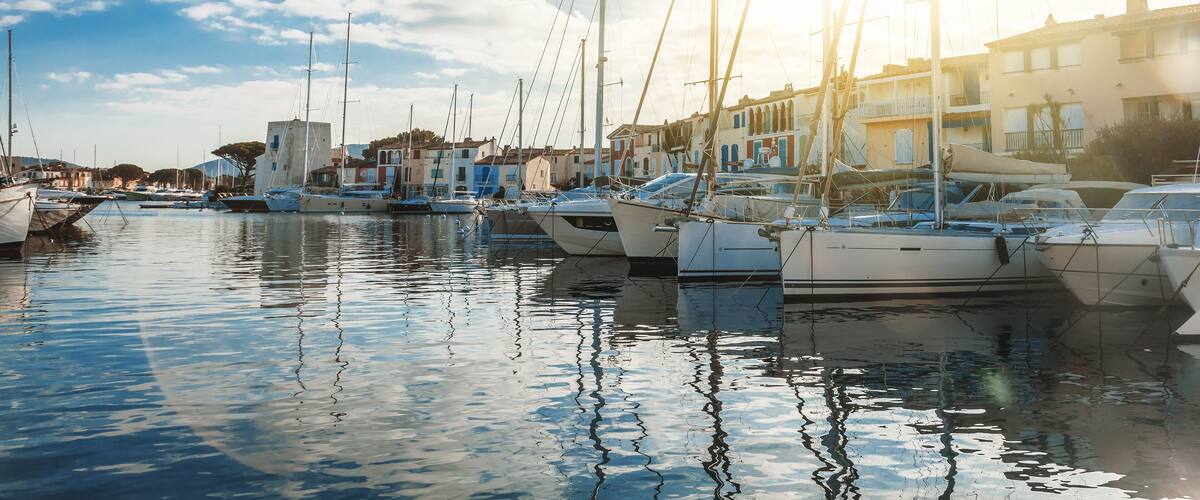 Colorful city on the water, Port of Grimaud, France, Provence, houses and boats. Beautiful city landscape; Shutterstock ID 1084314431; purchase_order: SP-1332 HA Batch 2 August 2018; Order: ; client: