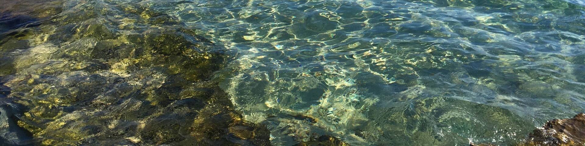 We took a cab to get the other side of the island for a more serene environment and turquoise waters. There are different parts of the beach to chill at. My friend got a mild sting from a tiny dying jellyfish that was washing ashore, but the lifeguard station was helpful.
Be sure to make reservations at Sunset Ashram for awesome sunset views. Understandably, the businesses there won't let you use their phone to call a taxi, so be prepared! All in all, it was the highlight of my visit to these islands and I highly recommend this beach.