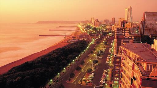 Durban showing a city, a high rise building and general coastal views