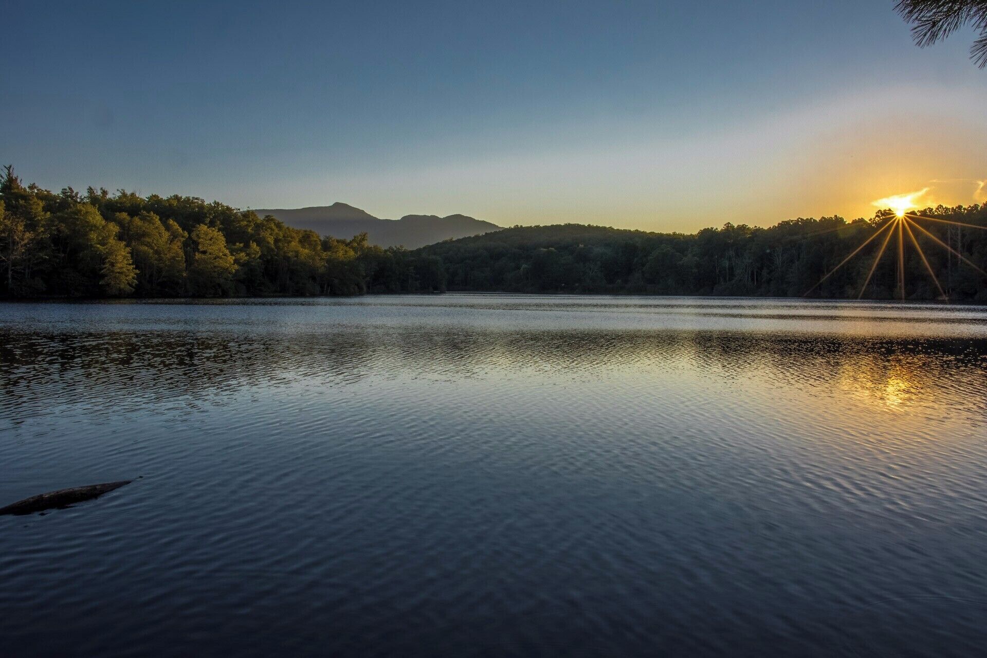 The beautiful Price Lake at sunset.  There is a wonderful 2+ mile trail that loops around the lake.  Learn all about it here:
https://www.hdcarolina.com/episode/price-lake-trail

#AquaTrove