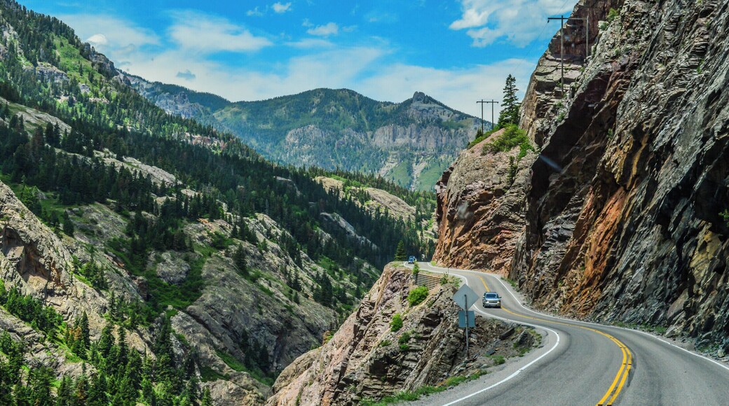 A section of US Route 550 that runs from Silverton to Ouray in Colorado is knows as "The Million Dollar Highway", and it's a thrilling (or terrifying) ride. Narrow roads, steep cliff walls, dizzying drop-offs....and no guard rails. It all makes for a white-knucke drive, albeit one with breath-taking views. There's some conjecture about the origin of the name - some say it's because it cost a million dollars to create, others say it's because of the million dollar views. Either way, it's a drive you won't soon forget. #colorado #ouray #milliondollarhighway #silverton #roadtrip #beautifuldrives
