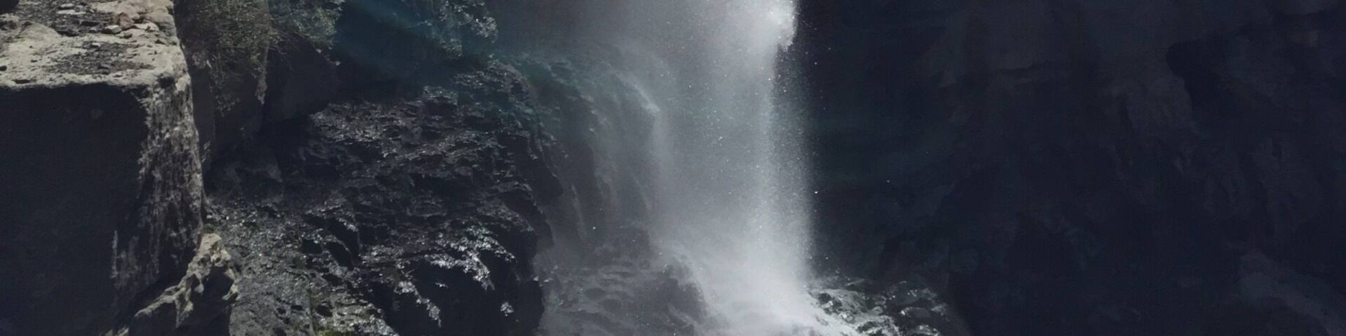 A waterfall cascading down a rocky cliff.