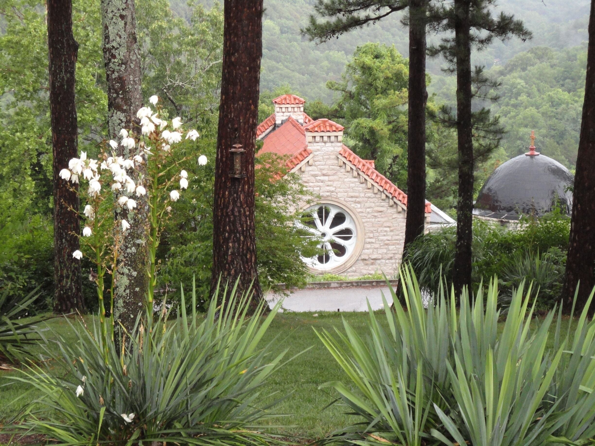 On our road trip from Texas to Eureka Springs, we discovered this quaint church nestled in amongst the trees, situated just below the Crescent Hotel.  LOVE Eureka Springs.  #quirky, #hippydippy #roadtrip
