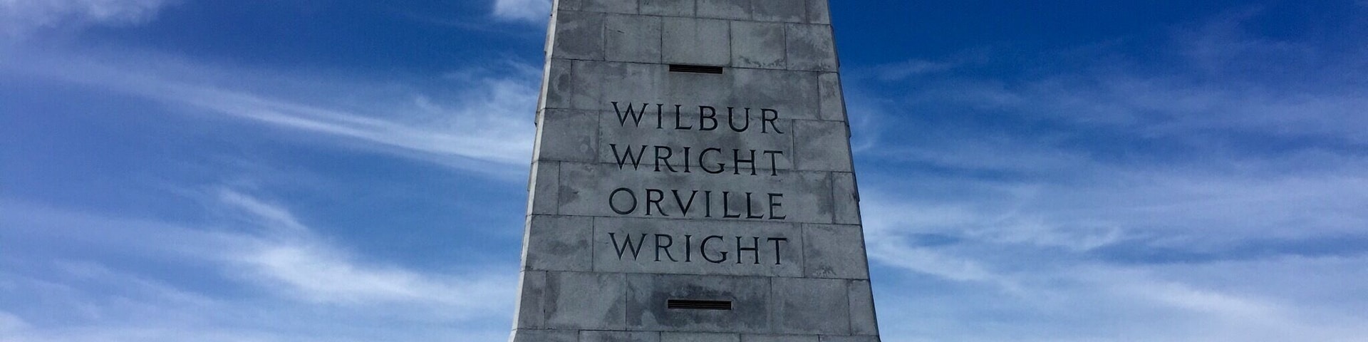 Wright Brothers National Memorial, located in Kill Devil Hills, North Carolina, commemorates the first successful, sustained, powered flights in a heavier-than-air machine. From 1900 to 1903, Wilbur and Orville Wright came here from Dayton, Ohio, based on information from the U.S. Weather Bureau about the area's steady winds. On my recent visit, those strong, steady winds were still blowing!!