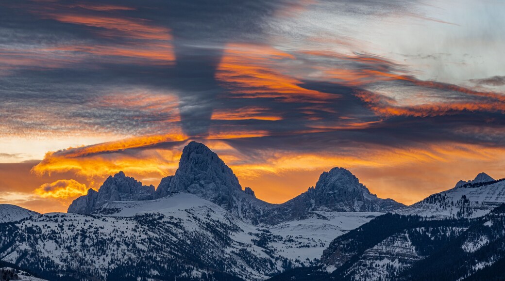 USA, Wyoming. Crepuscular rays over the Teton Mountains at sunrise.