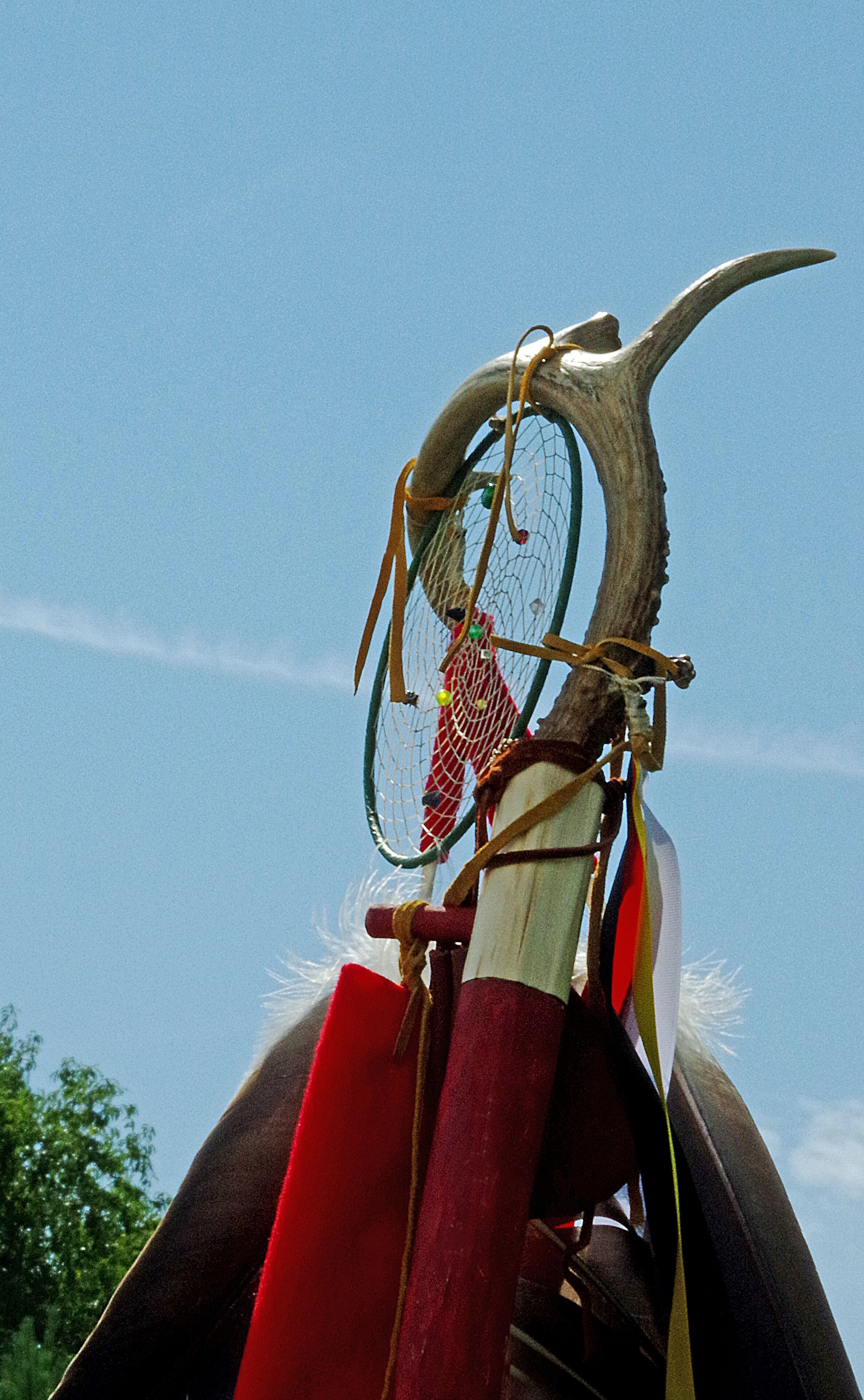 I had the opportunity to witness an American Indian PowWow. The traditions were memorable. Shown here is the upper section of a ceremonial staff showing a "Dream Catcher."