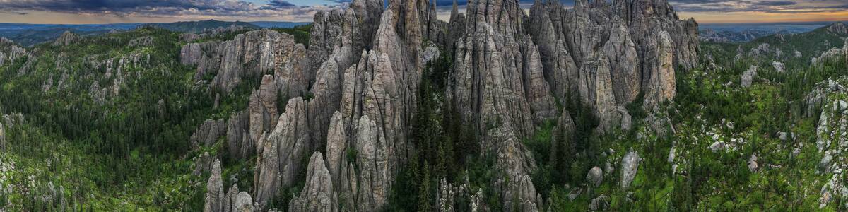 panorama of needles spires with storm clouds in the background off needles highway in black hills of South Dakota