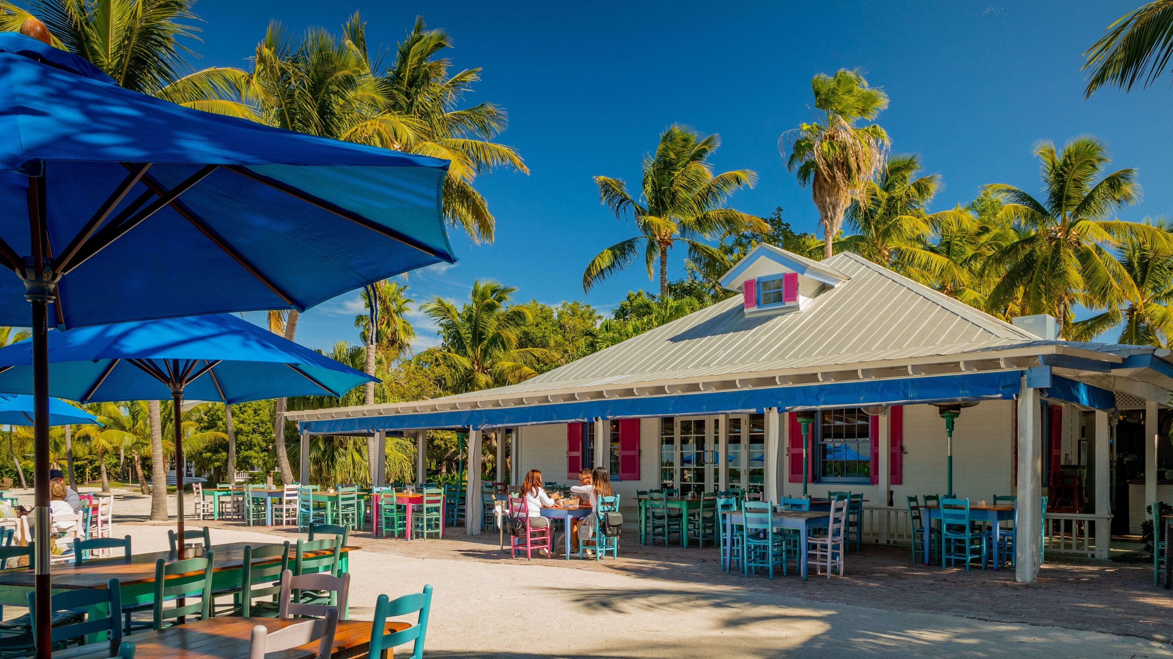 Islamorada showing outdoor eating as well as a small group of people