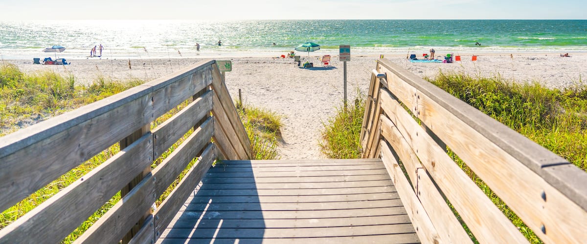 Wooden Boardwalk to Indian rocks beach in Florida, USA