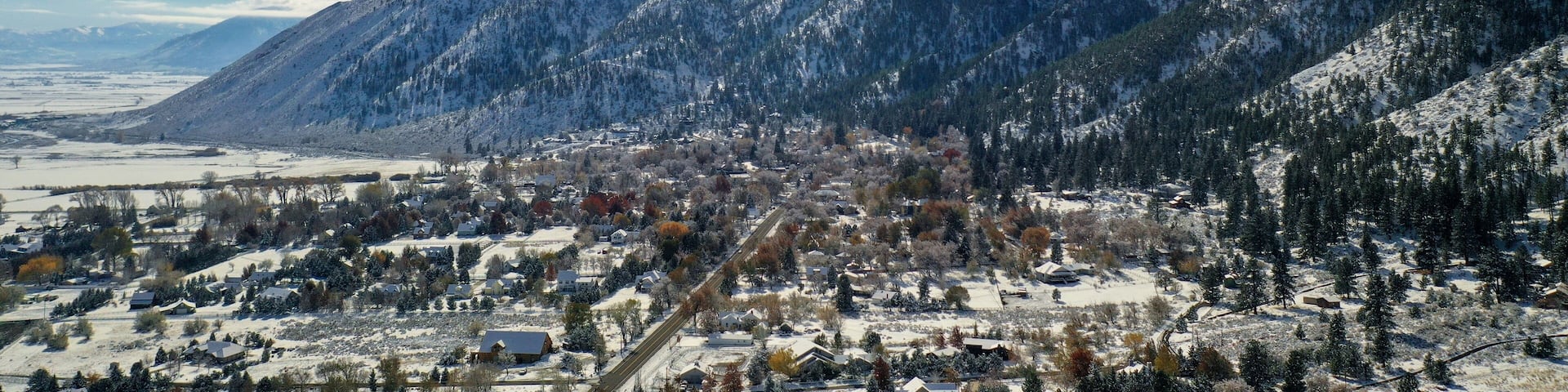 winter in the mountains drone aerial view of Genoa Nevada at the base of the Sierra