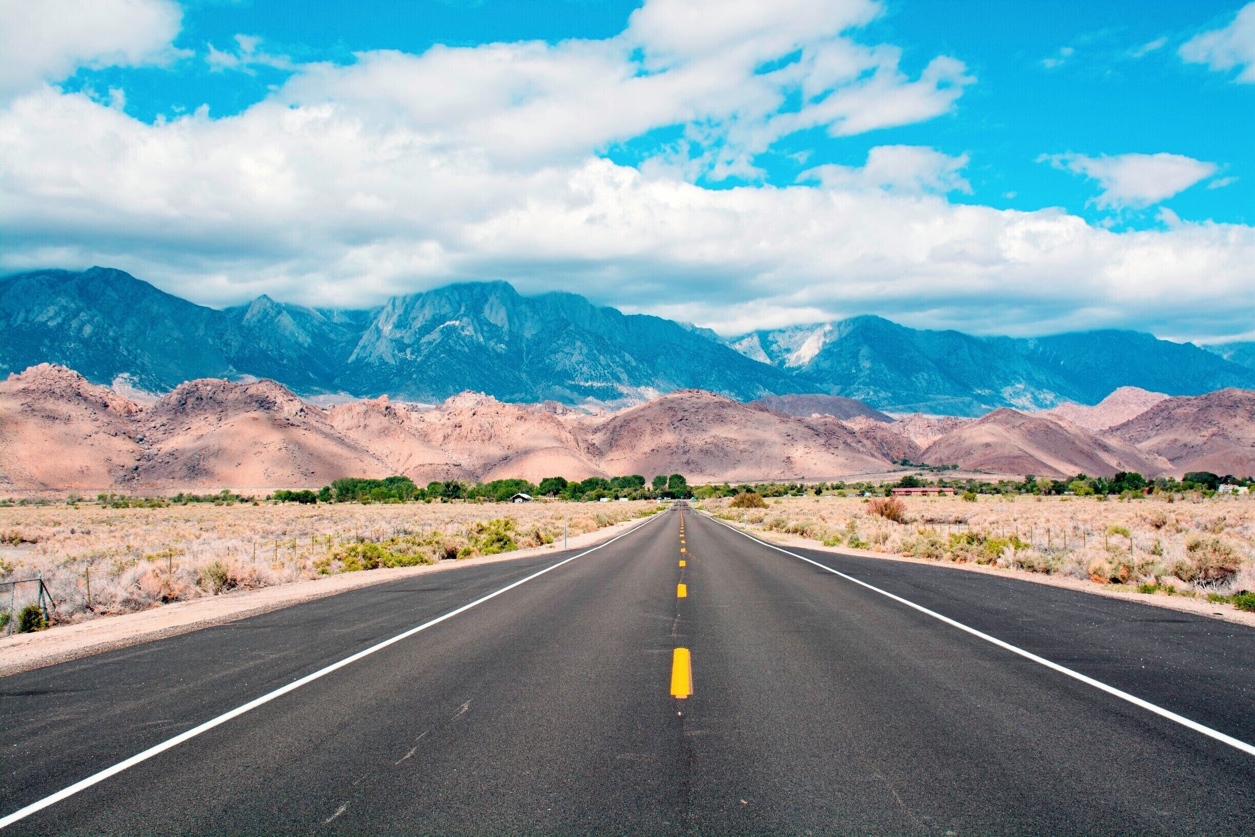 Driving toward the eastern front of the Sierra Nevada in The Owens Valley. Behind those clouds--a rare May snowstorm at the high elevations--is Mount Whitney, until 1959 the tallest peak in the United States. When Alaska became a state in that year, Mt. Whitney fell to number 12. I climbed the 14,505ft/4,421m peak twice as a Boy Scout.