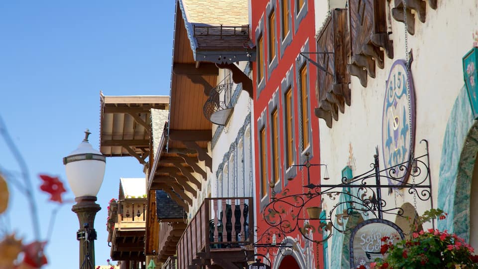 A colorful street with traditional architecture, including a building with a sign that reads "Soup Garden."