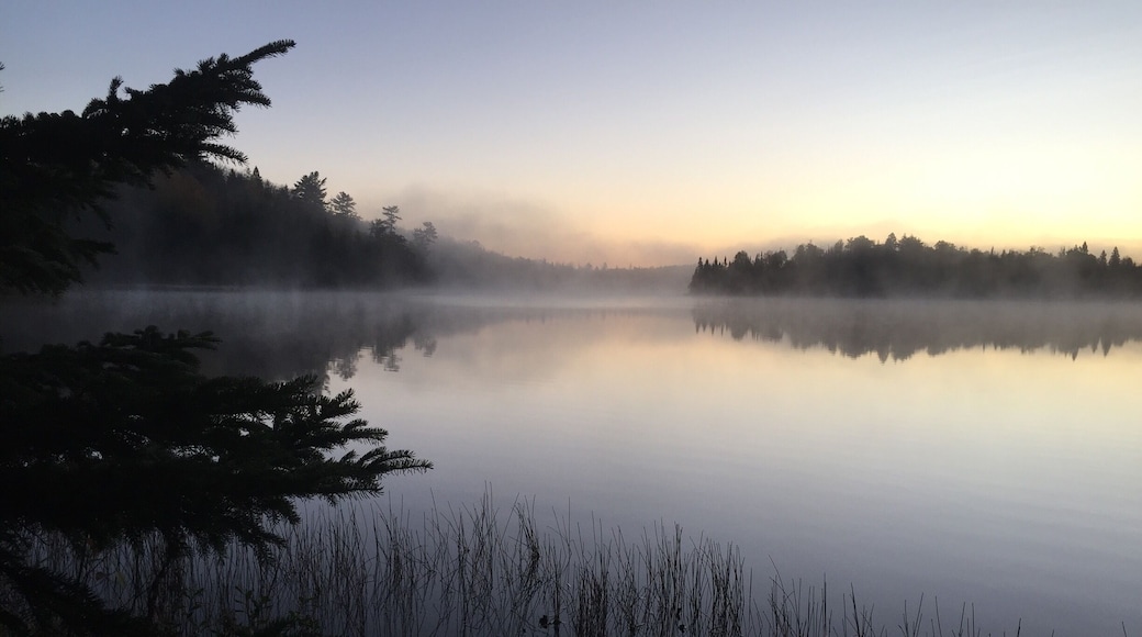 Cold morning sunrise over Lake Agnes while hiking the Superior Hiking Trail.