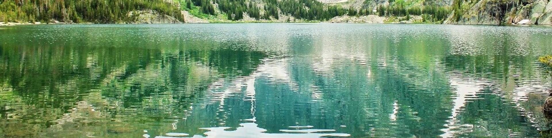 Remarkable views like this one at Twin Outlets scatter the Beaten Path trail in Montana.
The Beaten Path is a 26 mile hike that takes you from Cooke City to Rosebud, MT. As one of the prettiest hikes in the country, the Beaten Path takes you up and down a summit along cascades, 10+ waterfalls, granite canyons, and so many lakes that some of them don't have names.