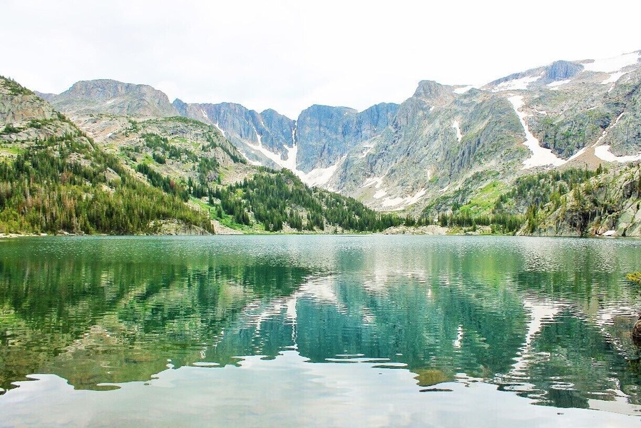 Remarkable views like this one at Twin Outlets scatter the Beaten Path trail in Montana.
The Beaten Path is a 26 mile hike that takes you from Cooke City to Rosebud, MT. As one of the prettiest hikes in the country, the Beaten Path takes you up and down a summit along cascades, 10+ waterfalls, granite canyons, and so many lakes that some of them don't have names.