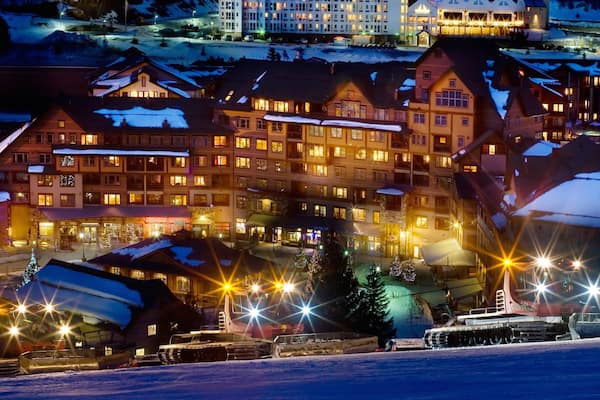 Winter Park featuring a luxury hotel or resort, snow and night scenes