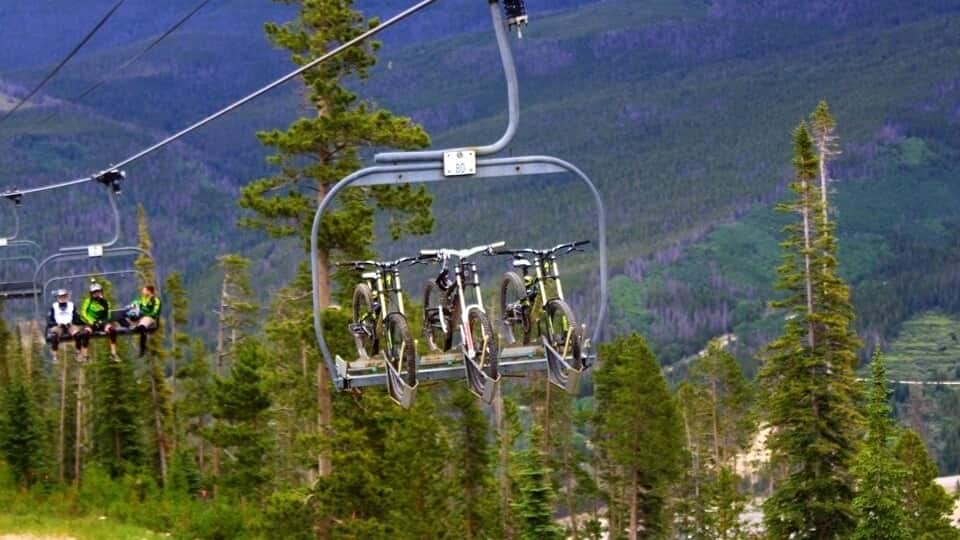 Mountain bikers in Winter Park head up the ski lift with their bikes.
#winterparkresort #colorado
http://thetradingtravelers.com/summer-adventures-at-winter-park-resort/