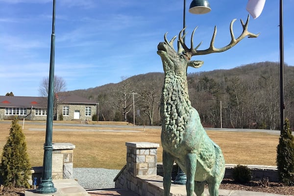 This is the headstone of Banner Elk, North Carolina. This elk has been in the town forever, but this past year the elk has been refurbished and installed as the centerpiece of the town. This elk frames Appalachia in the sense of this small town pride in the mountains. In the background you can see the historic elementary school and rolling mountains and once again the North Carolina pride of the state flag surrounding this elk even though about 100ft to the right there is another flagpole with the same flags raised high and proud. This is where every child in this town went to school in this picturesque location but as time rolls on is Appalachia move on too? #appalachianechoes