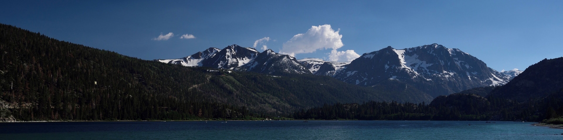 Serene and calm with a great view of mountains across the lake.