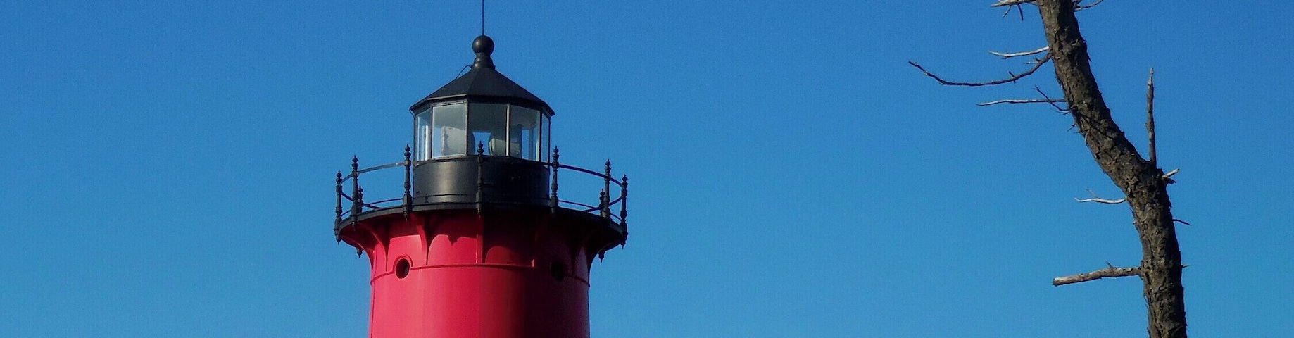 Active Lighthouses are distinguished by their painted pattern, and the color and timing of the light. This stretch of beach has seen the demise of many ships over the centuries. The most recent was the MV Eldia in 1984. Later pulled off the beach the ship went to the scrapyard. Dawn presents the best lighting for photographing the lighthouse.