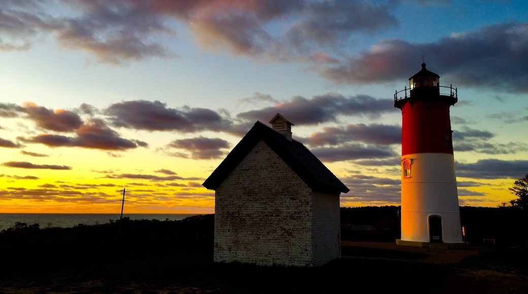 My favorite lighthouse in the world with its beautiful iconic red and white dress- setting high above a cliff - decommissioned but still shining her light - Mauser light- this photo was taken at sunrise as the sun crept above the fierce Atlantic - eastham, cape cod national seashore #lighthouses
