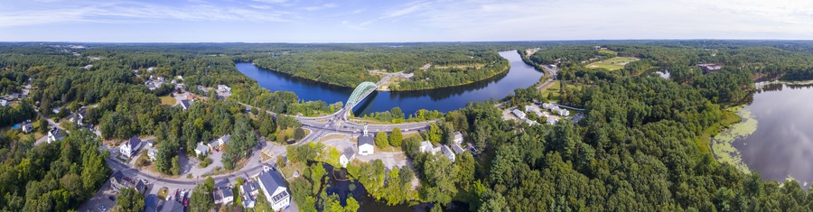 Aerial view of Merrimack River and Tyngsboro Bridge panorama in downtown Tyngsborough, Massachusetts, USA.