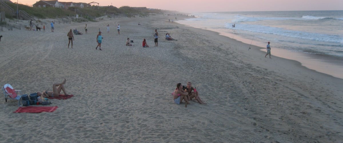View of late afternoon beach crowd, while dining outdoors at the Nag's Head Fishing Pier.