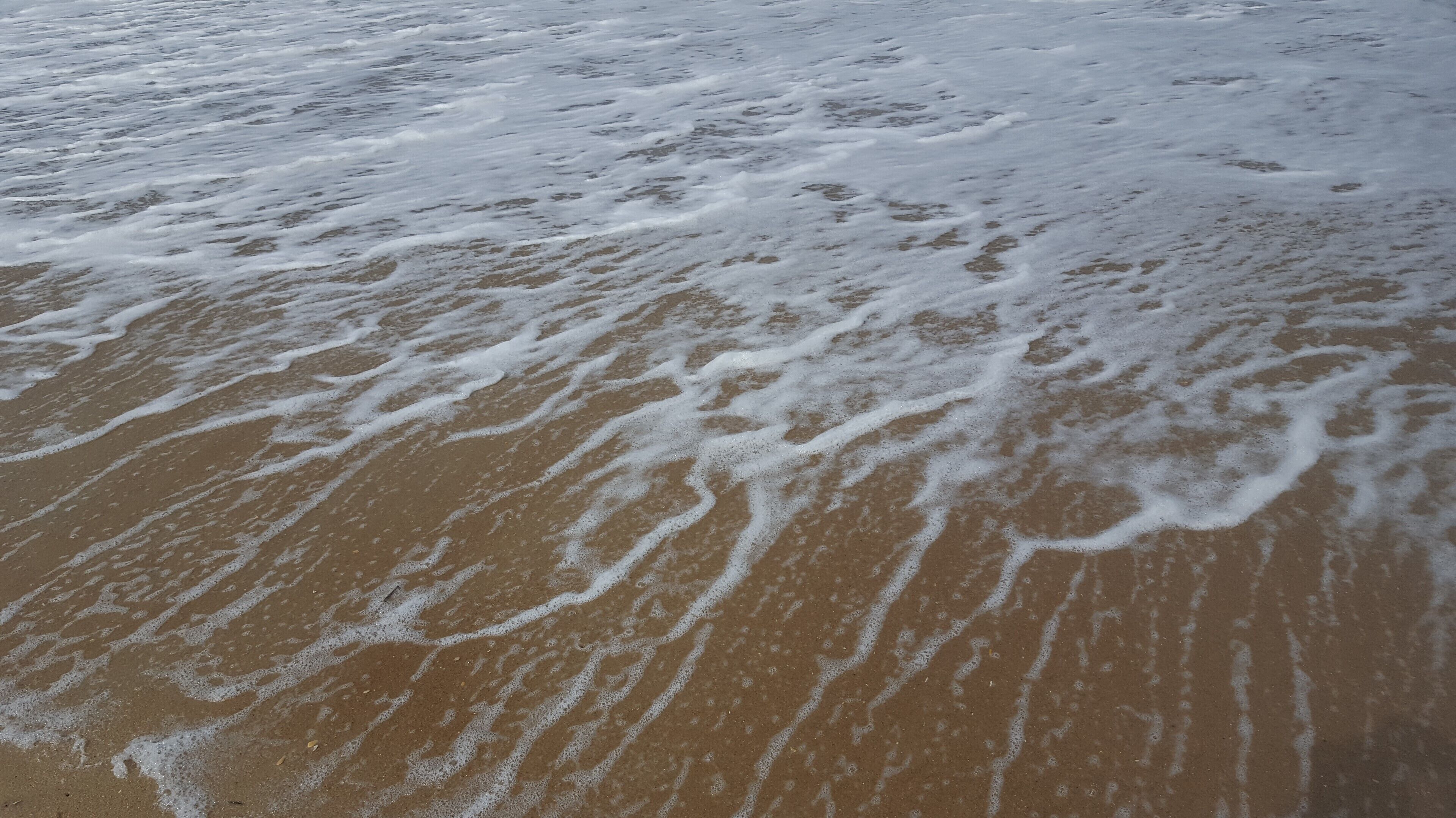Nag's head is exactly what you would picture an east coast beach to be - simple, trendy, touristy...just "quaint". I chose this photo over others because it is a different view of the typical "beach", investigating the movement of the water over the yellow sand in dim sunlight just made for a peaceful image.