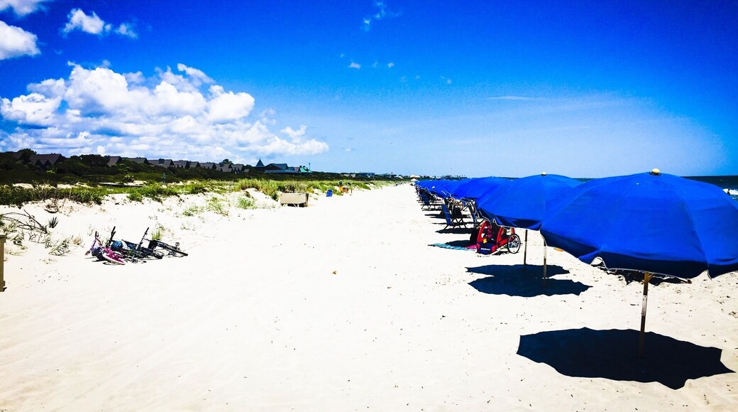The private part of the beach is the way to go if you can swing it, but the public beach is just as nice. It's just more crowded.