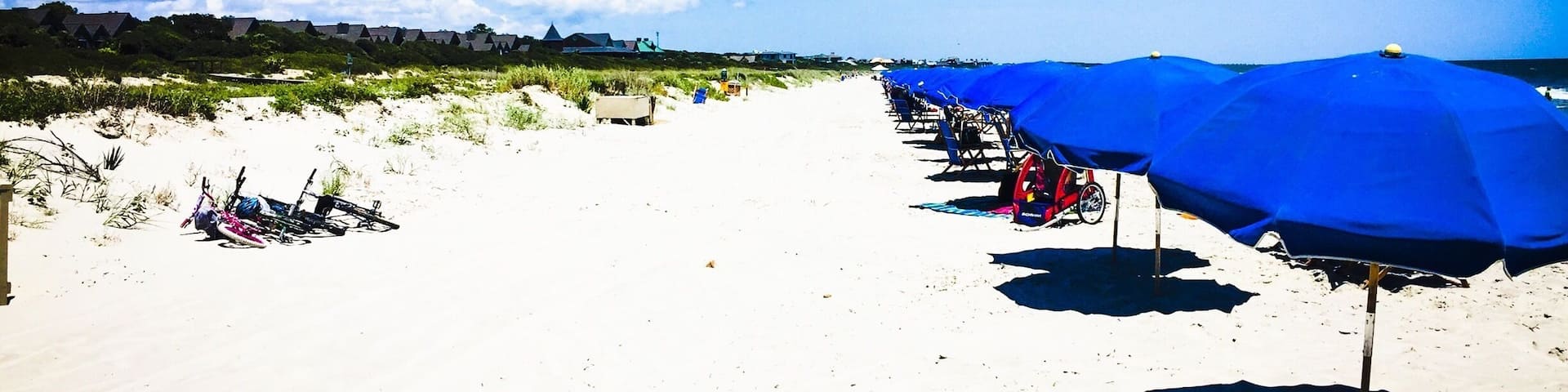 The private part of the beach is the way to go if you can swing it, but the public beach is just as nice. It's just more crowded.