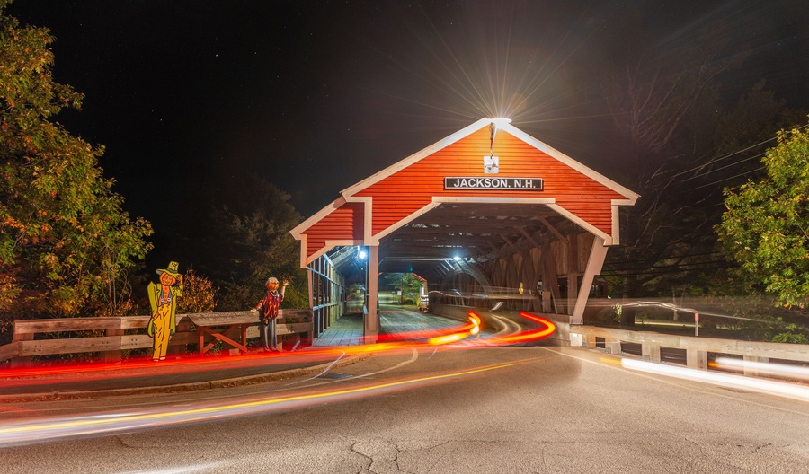 Covered Bridge in Jackson, New Hampshire. Night view with city traffic