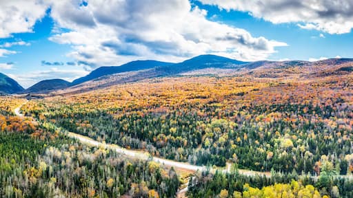 Aerial panorama US route 302 leading to Crawford Notch State park between Mount Webster and Willard. Mt Jackson (left), Willey, Field and Tom (right) are visible in the back.
