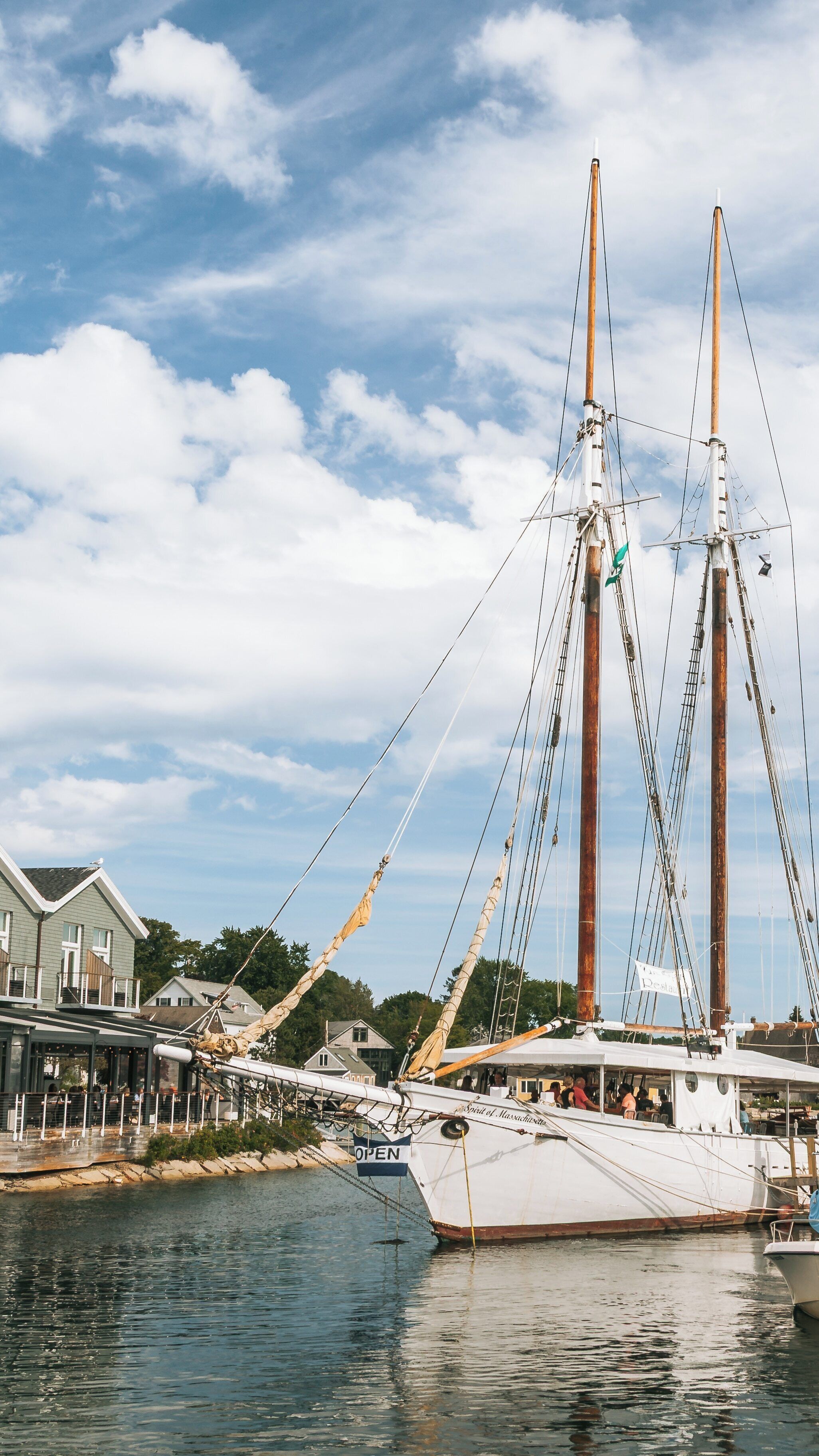 Sailing boats docked at Mother's Beach in Kennebunkport, Maine during a sunny afternoon