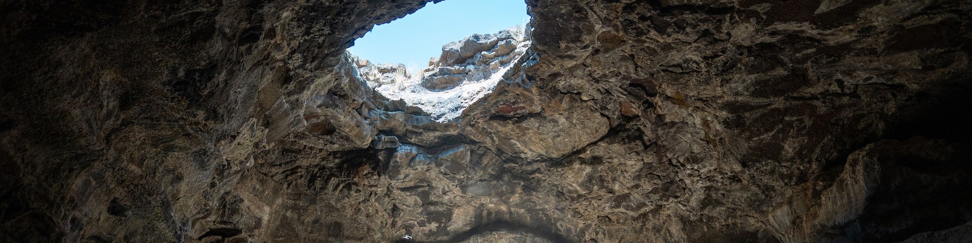 Tea Kettle Cave in Good, Idaho. This cave is open just like the top of a tea pot and is located in a hidden oasis in the southern Idaho desert in the western part of the United States.