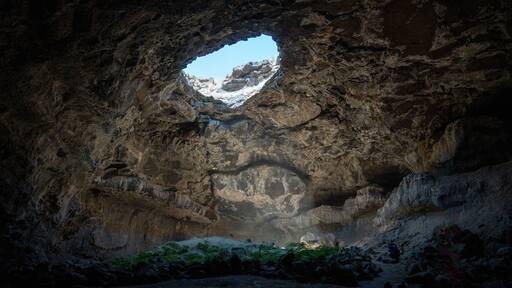 Tea Kettle Cave in Good, Idaho. This cave is open just like the top of a tea pot and is located in a hidden oasis in the southern Idaho desert in the western part of the United States.