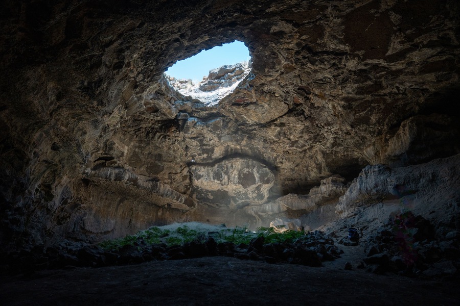 Tea Kettle Cave in Good, Idaho.  This cave is open just like the top of a tea pot and is located in a hidden oasis in the southern Idaho desert in the western part of the United States.