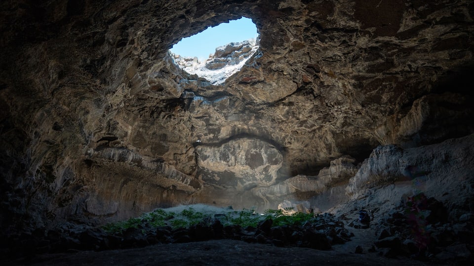 A cave entrance with a natural archway.