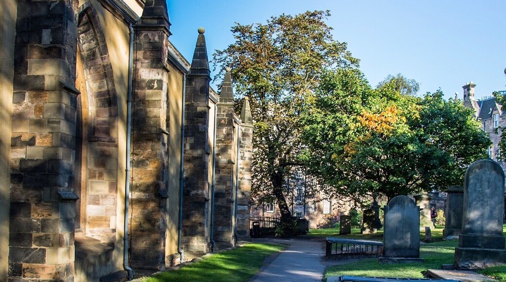 Greyfriars Kirkyard
© Paul Cunningham - Edinburgh Photo Guy
This Kirkyard is not haunted but has some history that equally is is unsettling. This place his estimated around over thousand bodies and more underneath the ground. Lots of the graves are unmarked after most of the bodies were moved from the first graveyard of Edinburgh's Old Town, St Giles behind the cathedral were moved to here.
Greyfriars takes its name from the Franciscan friary on the site (the monks of which wore grey robes), which was dissolved in 1559. The churchyard was founded in 1561, then Mary Queen of Scots made the land available for a burial ground, before then it was a herb garden to cure illnesses. St Giles burial ground was running out of room for burials.
In more recent times in history this place was rife for body snatchers, hence the mortsafe protected grave in this image.
Paul