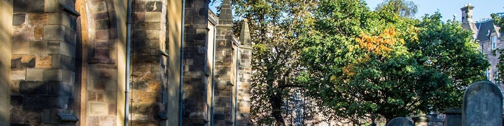 Greyfriars Kirkyard
© Paul Cunningham - Edinburgh Photo Guy
This Kirkyard is not haunted but has some history that equally is is unsettling. This place his estimated around over thousand bodies and more underneath the ground. Lots of the graves are unmarked after most of the bodies were moved from the first graveyard of Edinburgh's Old Town, St Giles behind the cathedral were moved to here.
Greyfriars takes its name from the Franciscan friary on the site (the monks of which wore grey robes), which was dissolved in 1559. The churchyard was founded in 1561, then Mary Queen of Scots made the land available for a burial ground, before then it was a herb garden to cure illnesses. St Giles burial ground was running out of room for burials.
In more recent times in history this place was rife for body snatchers, hence the mortsafe protected grave in this image.
Paul