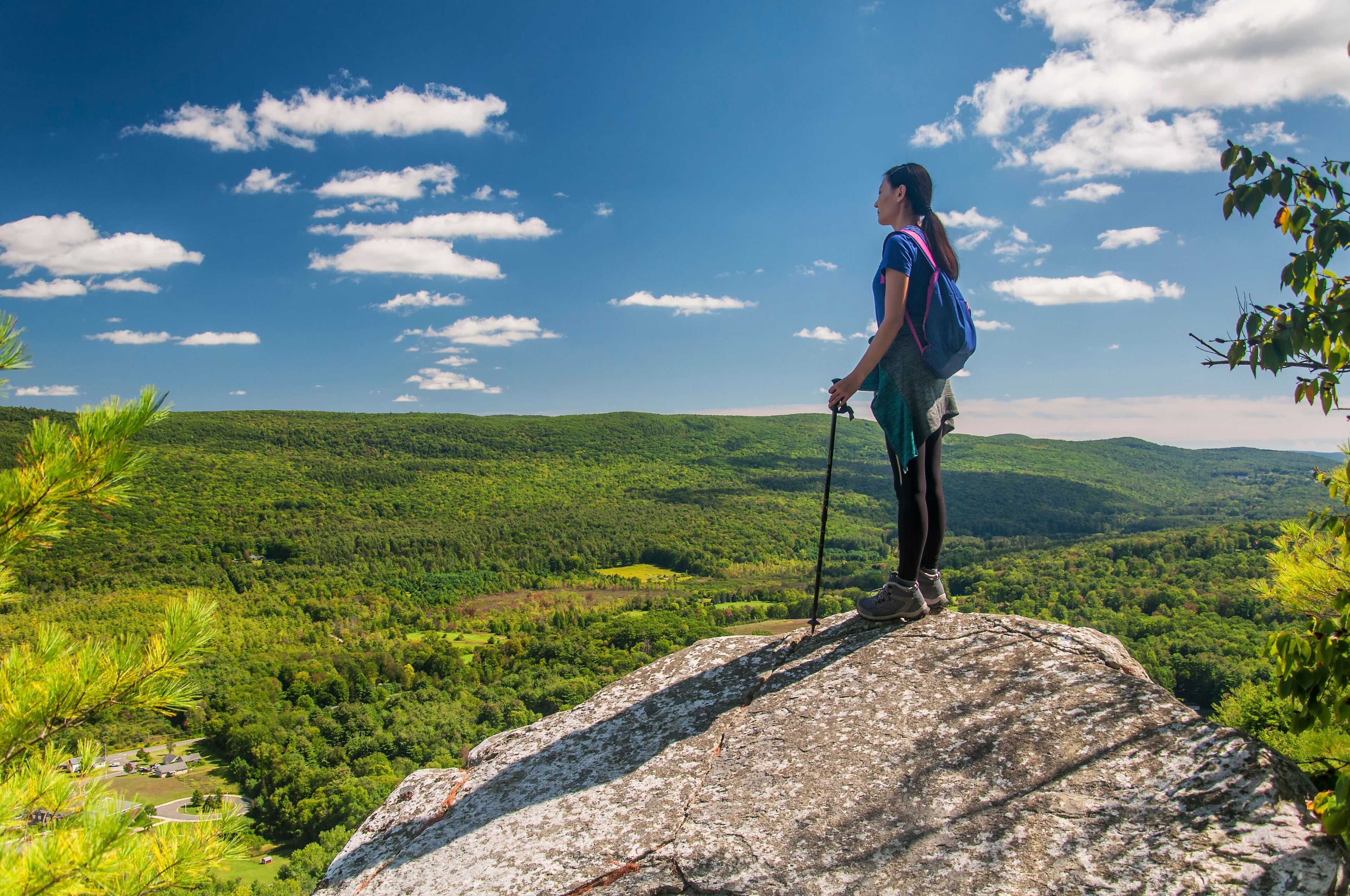 female hiker on top of Monument Mountain Summit