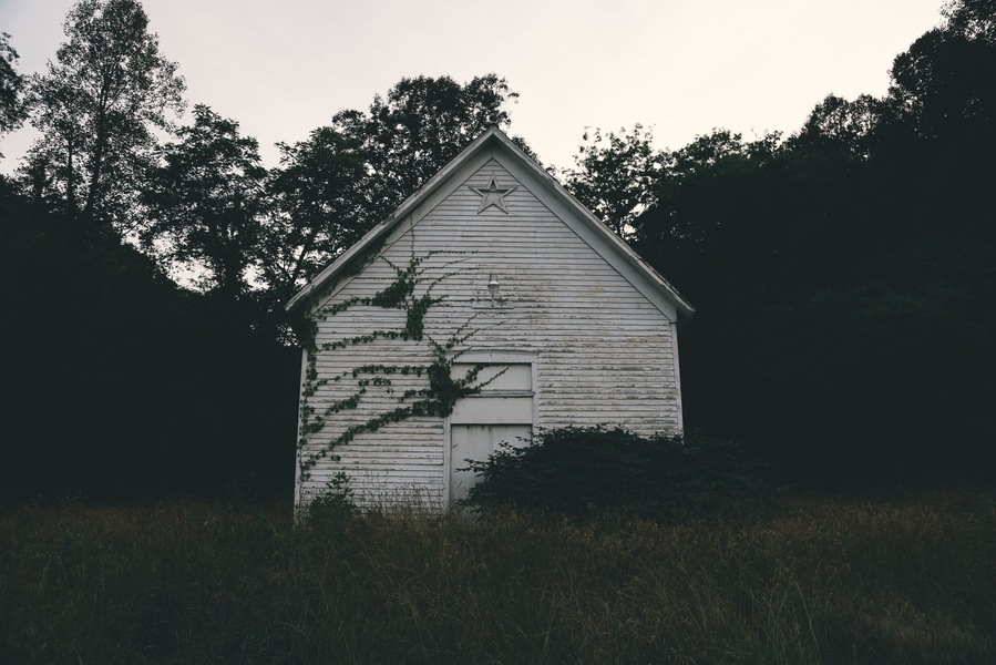 an old church right off of US 23 in greenup, ky. i found perfectly-placed crocheted blankets and, strangely, a flower vase knocked off of a table onto the floor.