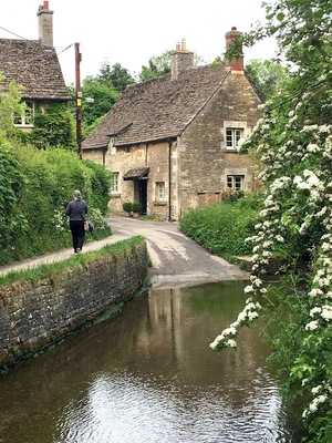 Ford crossing in the medieval market village of Lacock with its houses dating back over 800 years and historic Lacock Abbey home of English scientist, inventor and photography pioneer of Henry Fox Talbot.