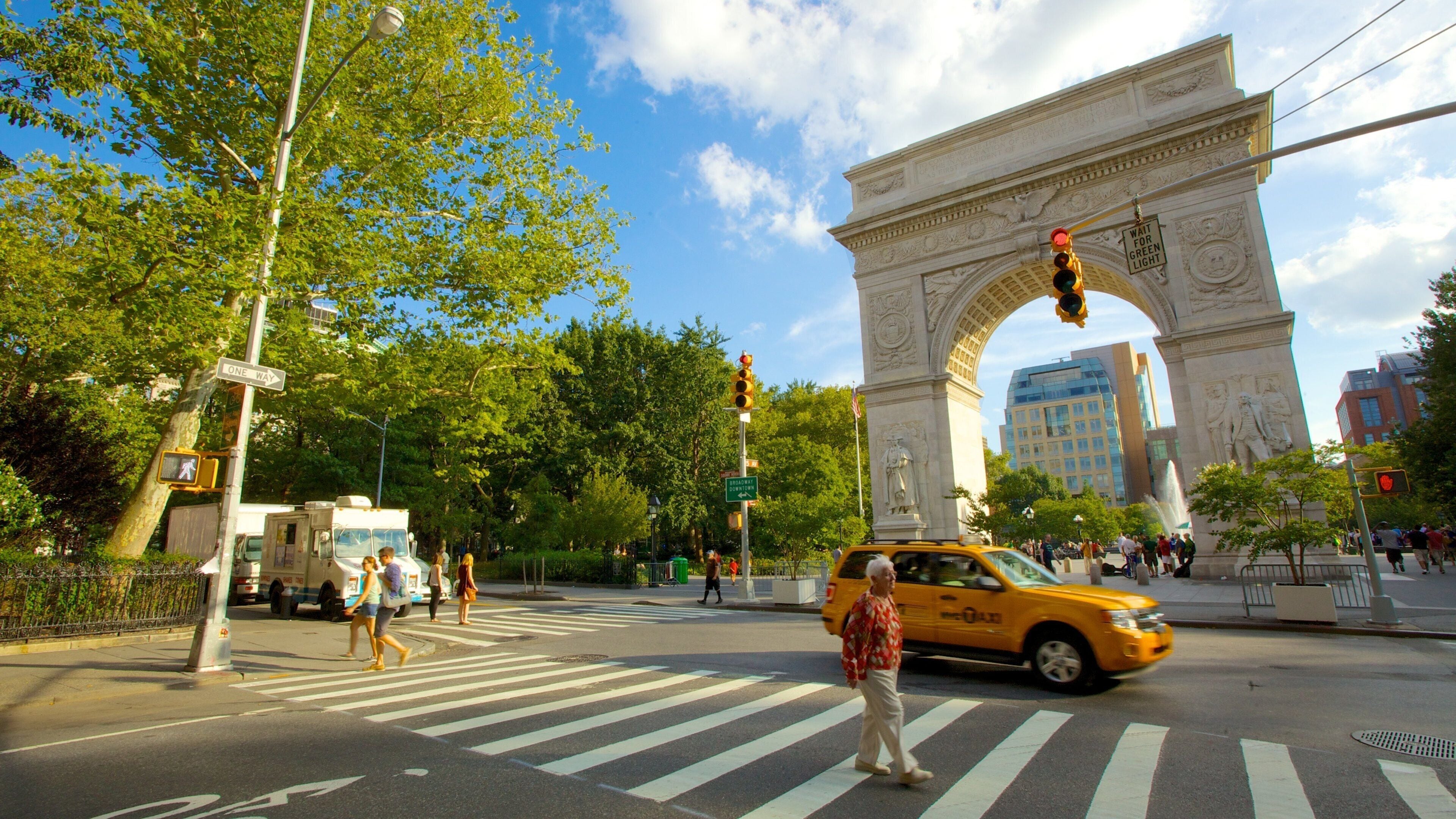Greenwich Village which includes a city, street scenes and a monument