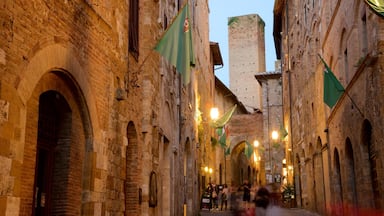 San Gimignano which includes night scenes, street scenes and heritage architecture