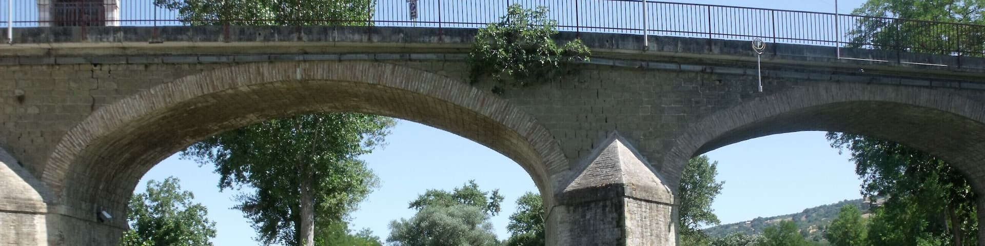 Brigde Ponte a Petrignano and the Chiascio river in Petrignano, hamlet of Assisi, Province of Perugia, Umbria, Italy